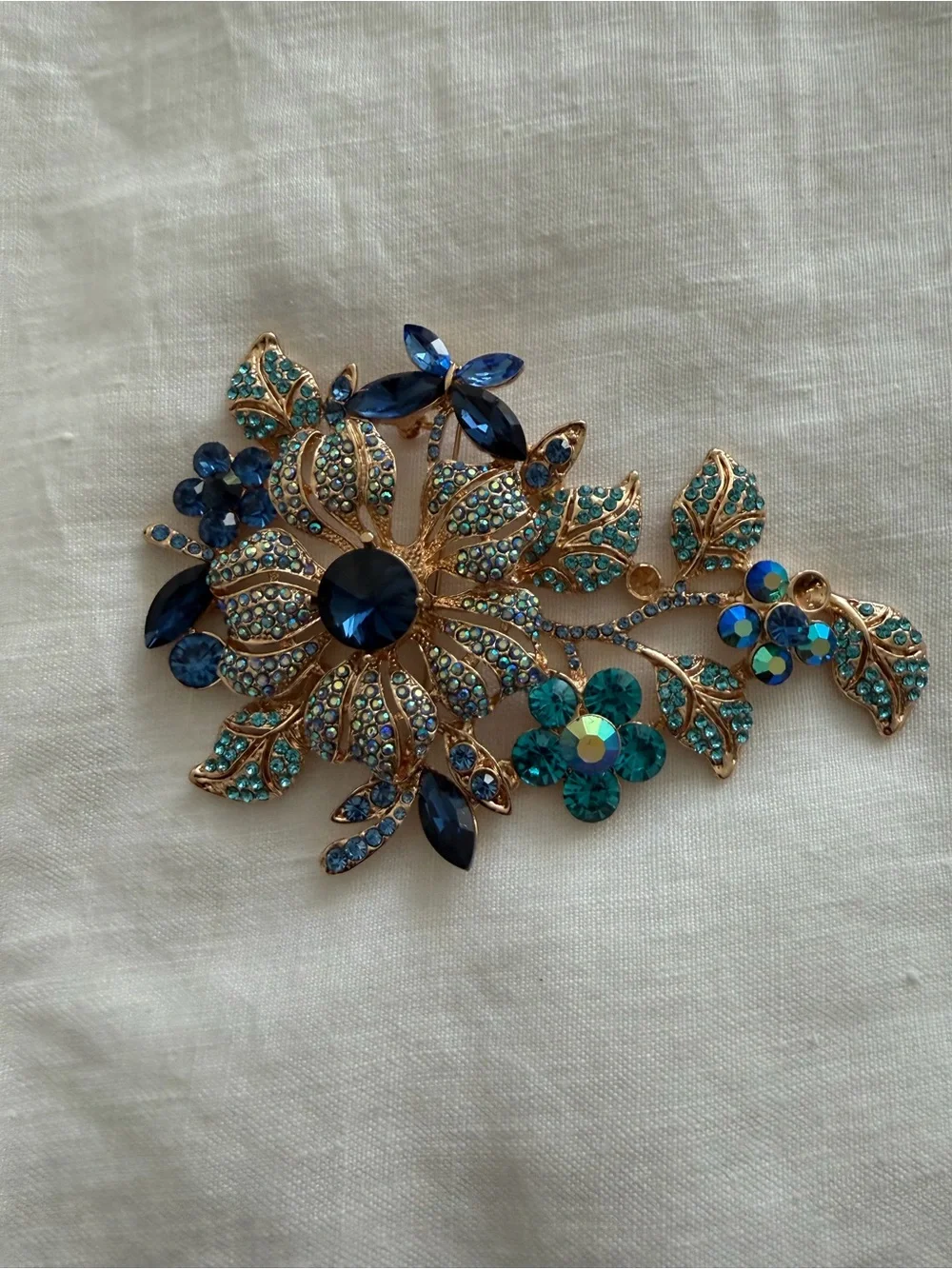 Gold-Tone Floral Crystal Brooch in Blue and Teal